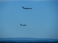 The Udvar-Hazy Center is right next to and with a view onto Washington Dulles International Airport. These two planes landed simultaneously on two parallel runways.