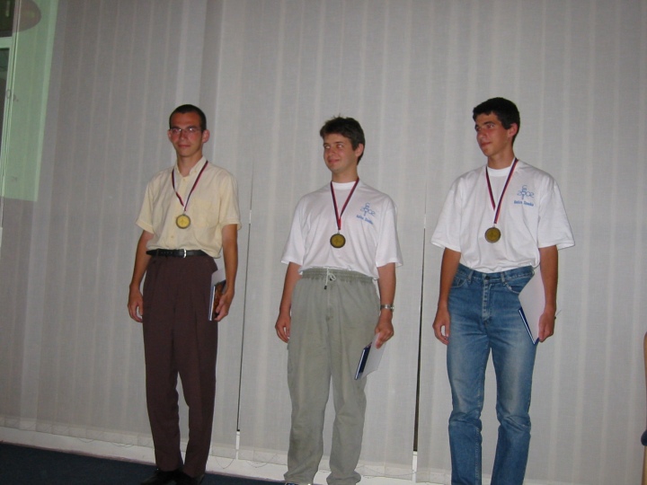 the three gold medalists: Peter Bella from Slovakia and two romanians