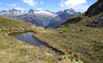 View back onto Harris Saddle, with the emergency shelter in the center and Mts Gunn and Lyttle in the background