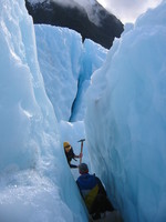 Our guide and two of us walking through a small crevasse.