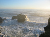 slightly rough sea, and some rocks