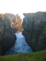 Near Punakaki - note the pancake rocks (layered limestone rocks) in the upper right of the picture.